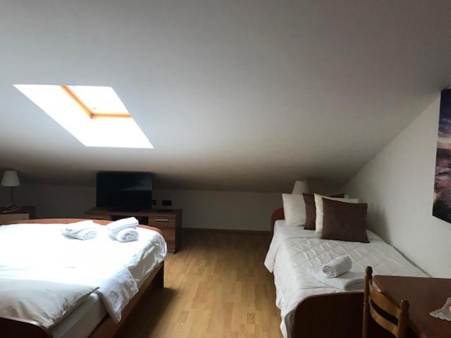 Posteľ alebo postele v izbe v ubytovaní Apartments Vunić