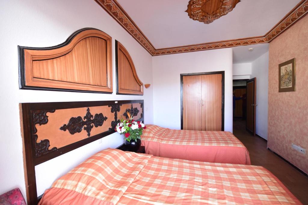 Postel nebo postele na pokoji v ubytování Sud Bahia Agadir "Bahia City Hotel"