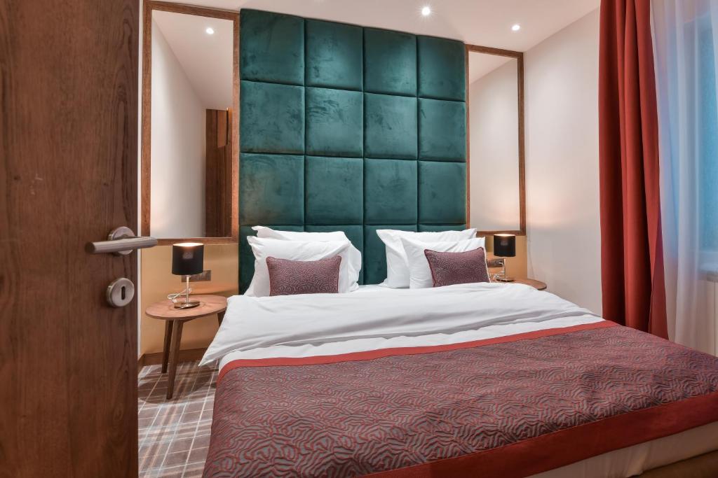 Postel nebo postele na pokoji v ubytování Hotel Putnik Kopaonik