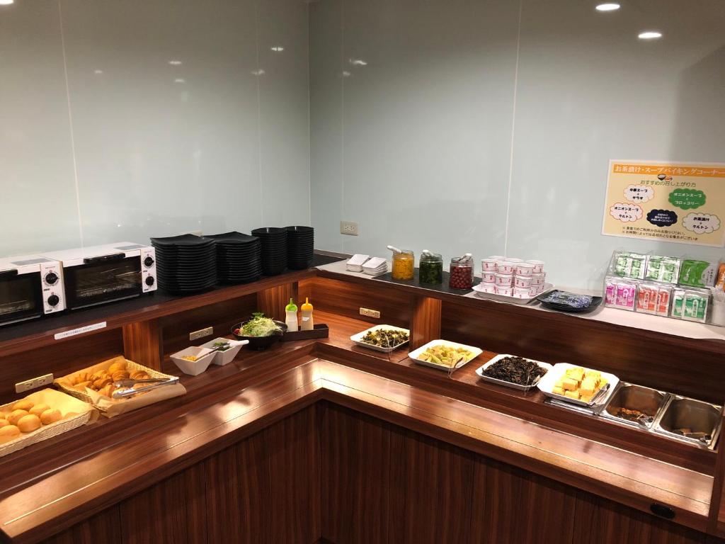 a buffet line with many different types of food at Business Hotel Fiz Nagoya Airport in Toyoyama