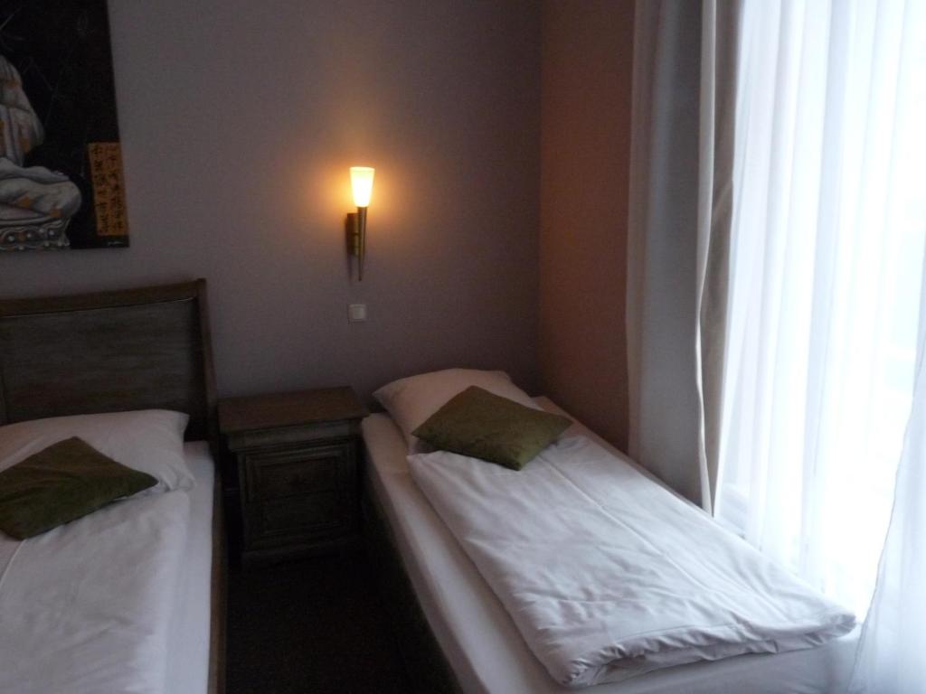 Postel nebo postele na pokoji v ubytování Hotel Commodore