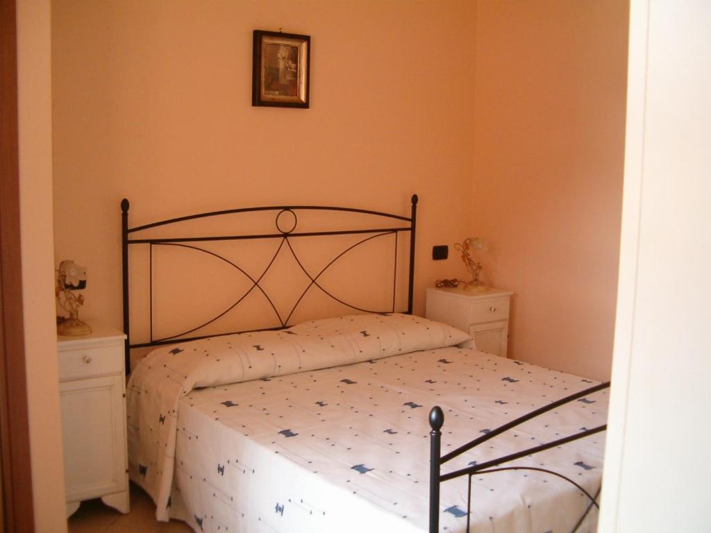 Postel nebo postele na pokoji v ubytování Agriturismo Isorella