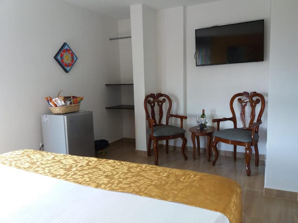 Postel nebo postele na pokoji v ubytování Hotel Anzea