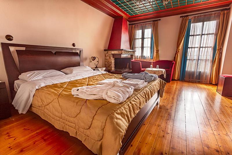 Postel nebo postele na pokoji v ubytování Hotel Ladias
