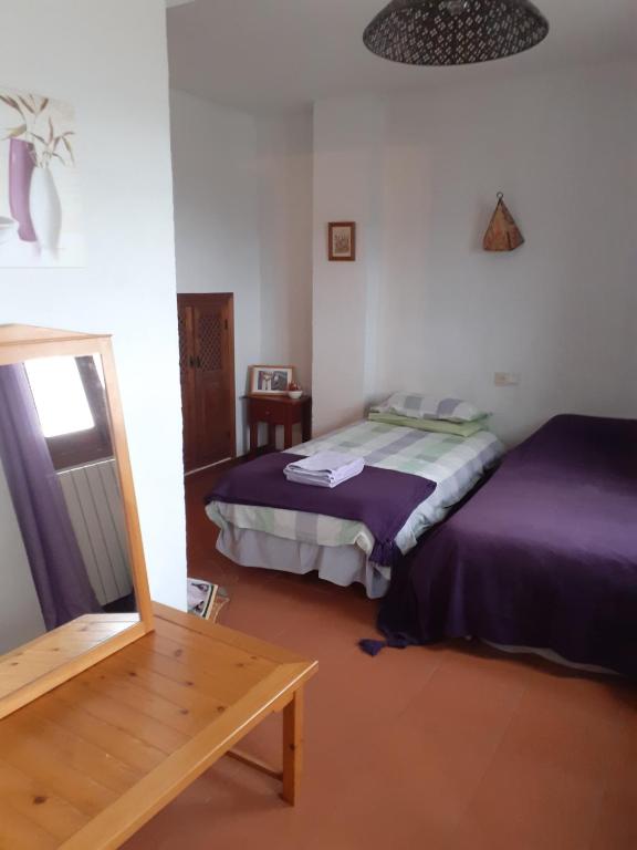 Postel nebo postele na pokoji v ubytování El Tinao
