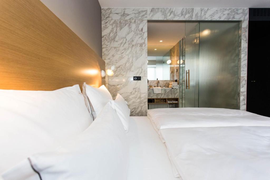 Posteľ alebo postele v izbe v ubytovaní The Guesthouse Vienna