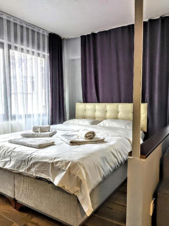 Postel nebo postele na pokoji v ubytování Rodos HAN