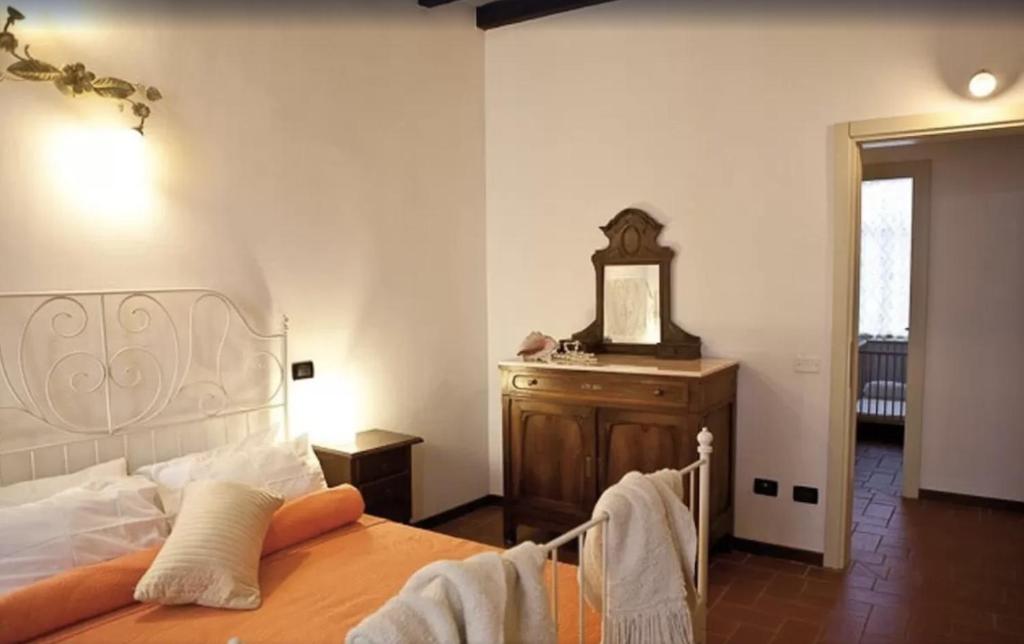 Postel nebo postele na pokoji v ubytování Castello Oldofredi