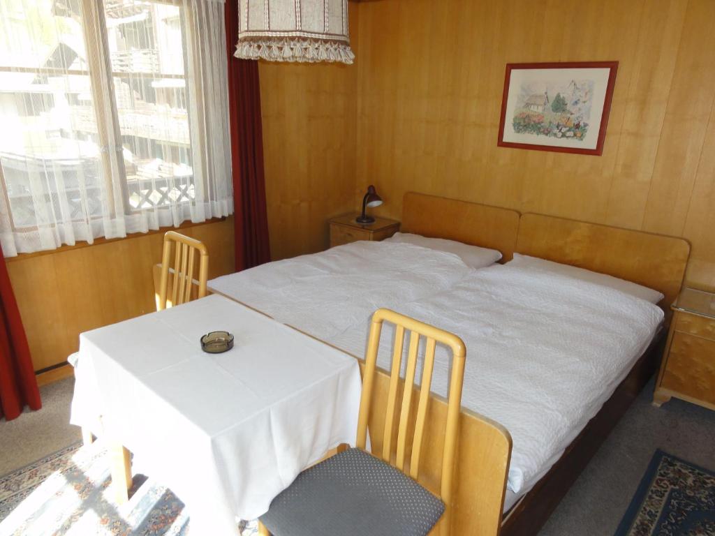 Postel nebo postele na pokoji v ubytování Hotel Cima