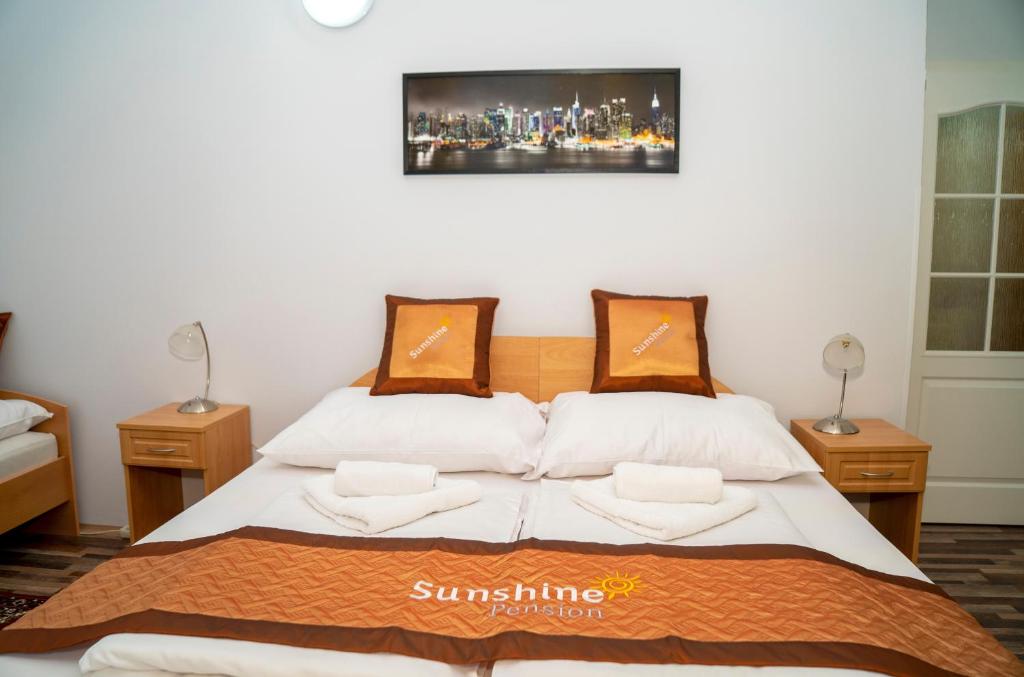 Postel nebo postele na pokoji v ubytování Sunshine Pension
