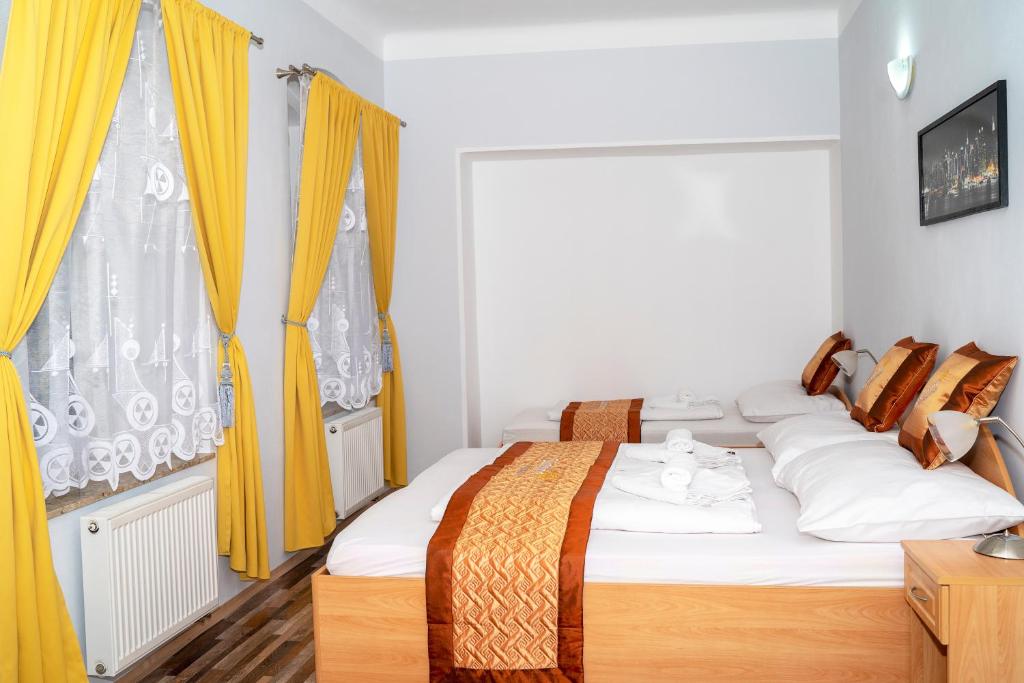 Postel nebo postele na pokoji v ubytování Sunshine Pension
