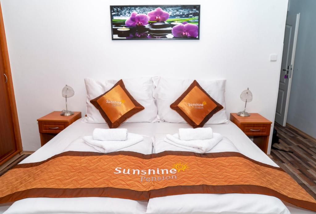 Postel nebo postele na pokoji v ubytování Sunshine Pension