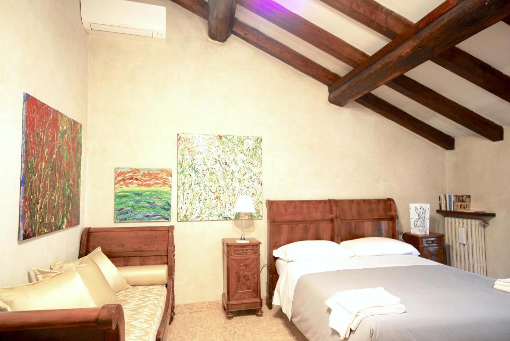 Postel nebo postele na pokoji v ubytování Casa del Pittore