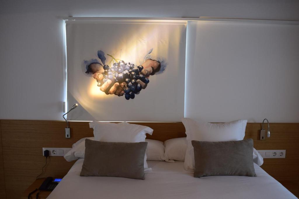 A bed or beds in a room at Hotel Nande