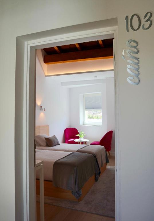 A bed or beds in a room at Hotel Nande