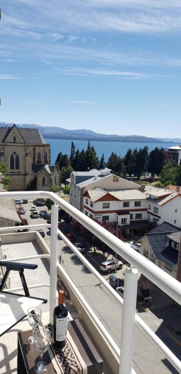 a view of a city from the balcony of a building at Bariloche Modern Apartment in San Carlos de Bariloche