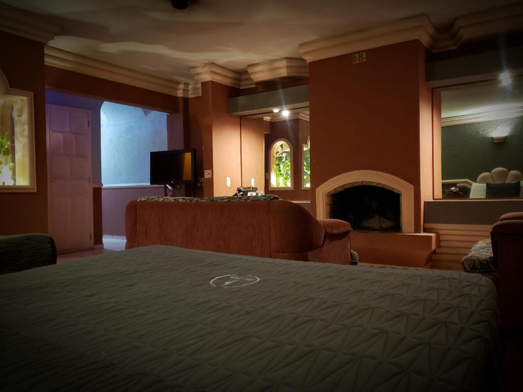 TV a/nebo společenská místnost v ubytování New York Hotel/Motel