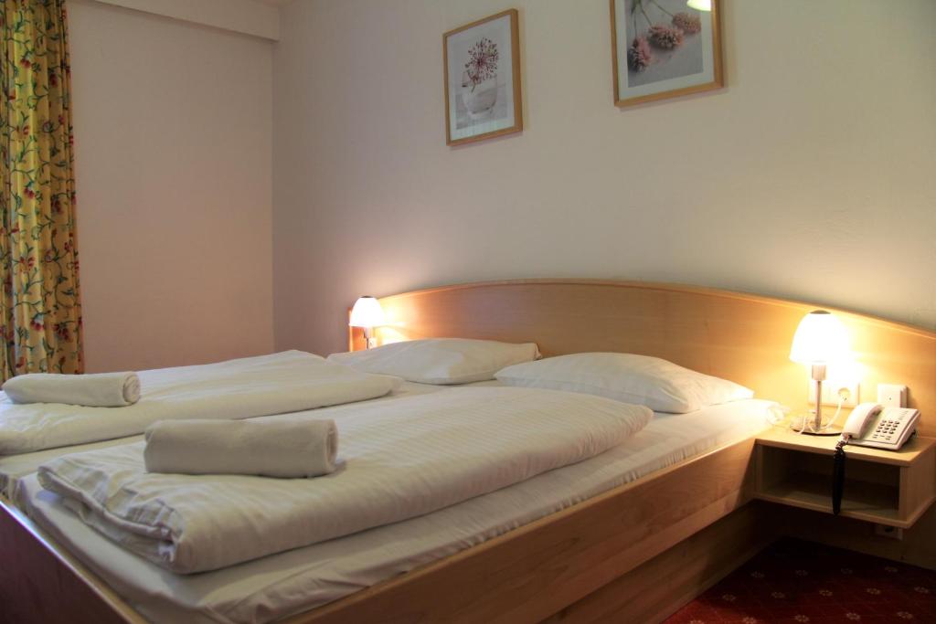 Posteľ alebo postele v izbe v ubytovaní Hotel Post