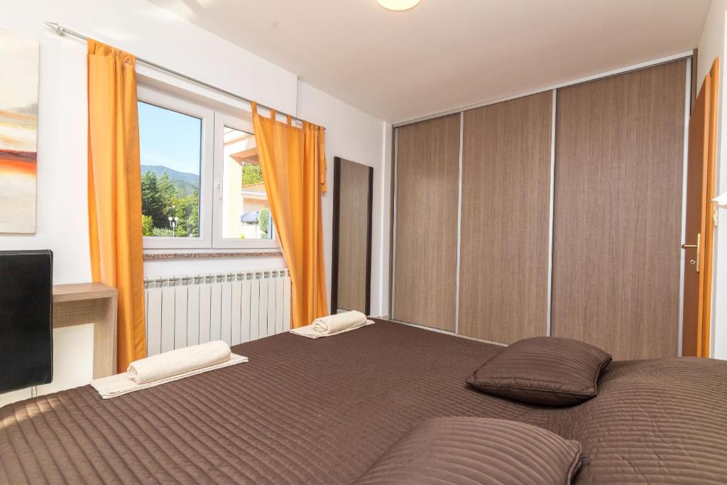 Posteľ alebo postele v izbe v ubytovaní Apartments Villa Adore