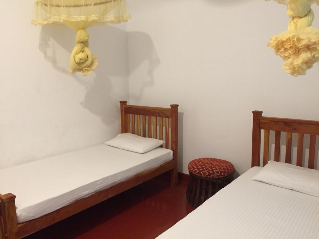 Postel nebo postele na pokoji v ubytování Best hostel Yala
