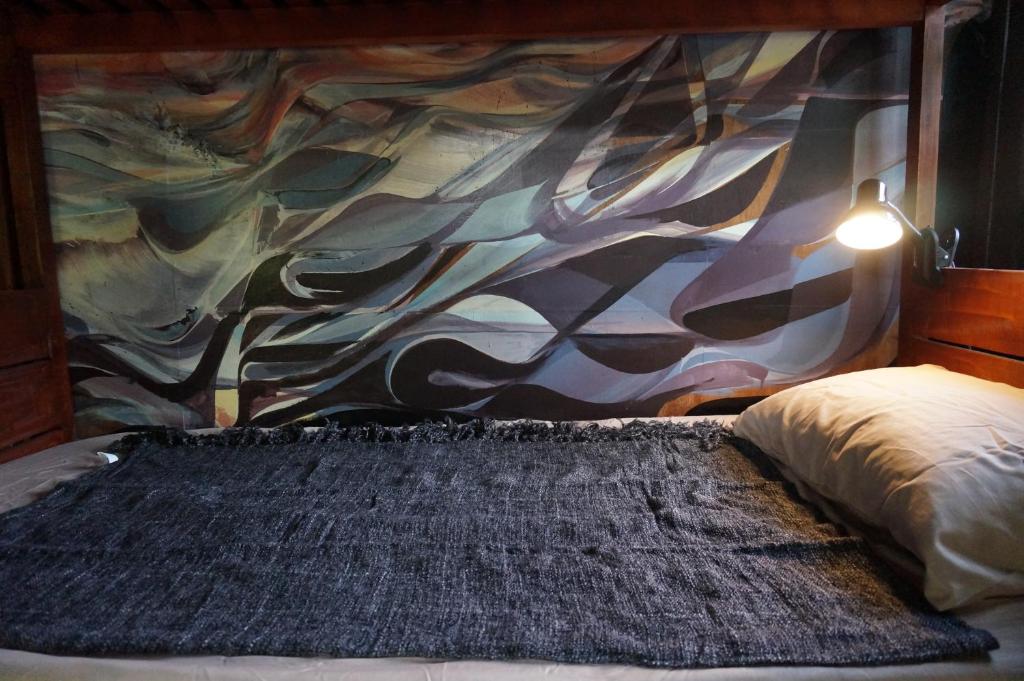 Postel nebo postele na pokoji v ubytování Peaceland Hostel