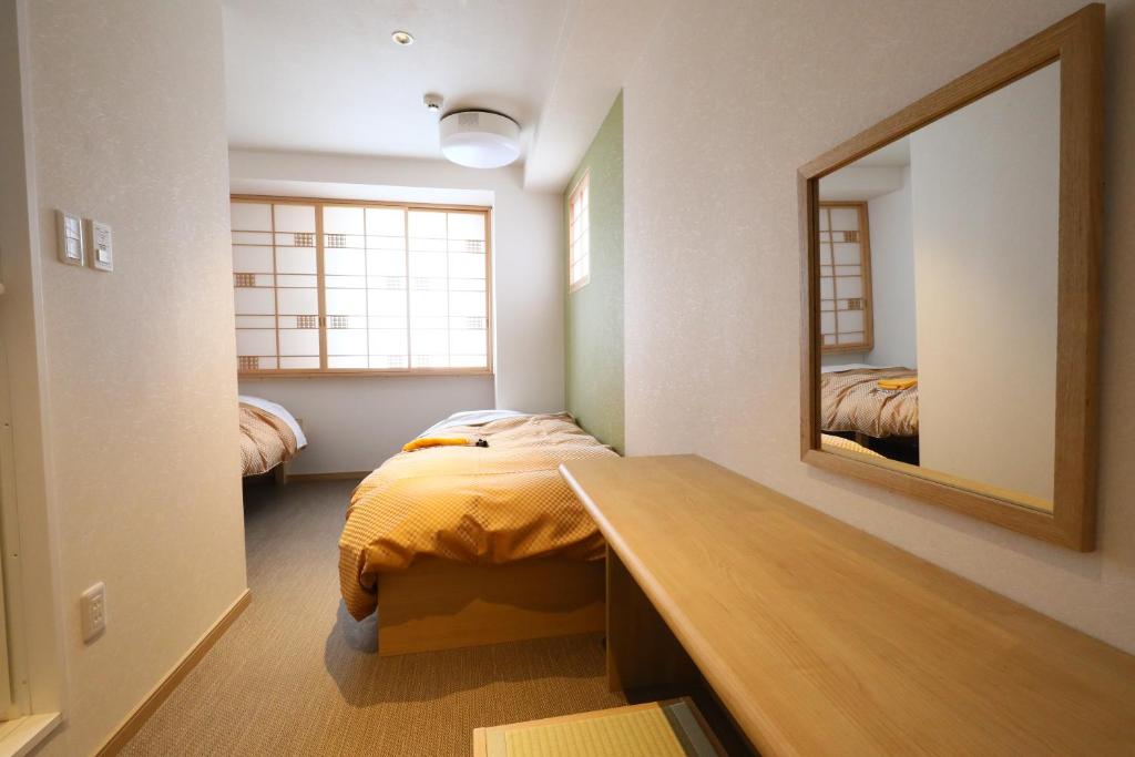 Postel nebo postele na pokoji v ubytování Wa Style Tokyo
