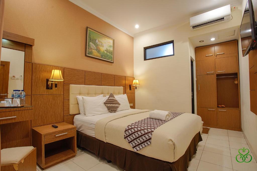 Posteľ alebo postele v izbe v ubytovaní Selaras Inn Syariah