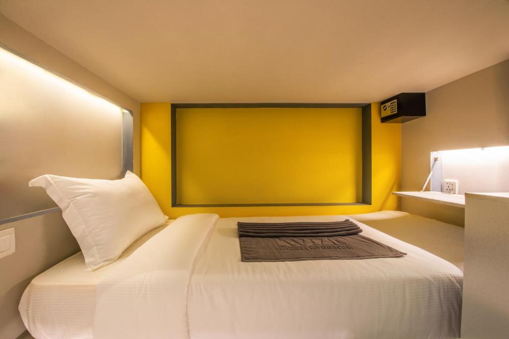 Postel nebo postele na pokoji v ubytování The Twizt - Lifestyle Hostel & Hotel