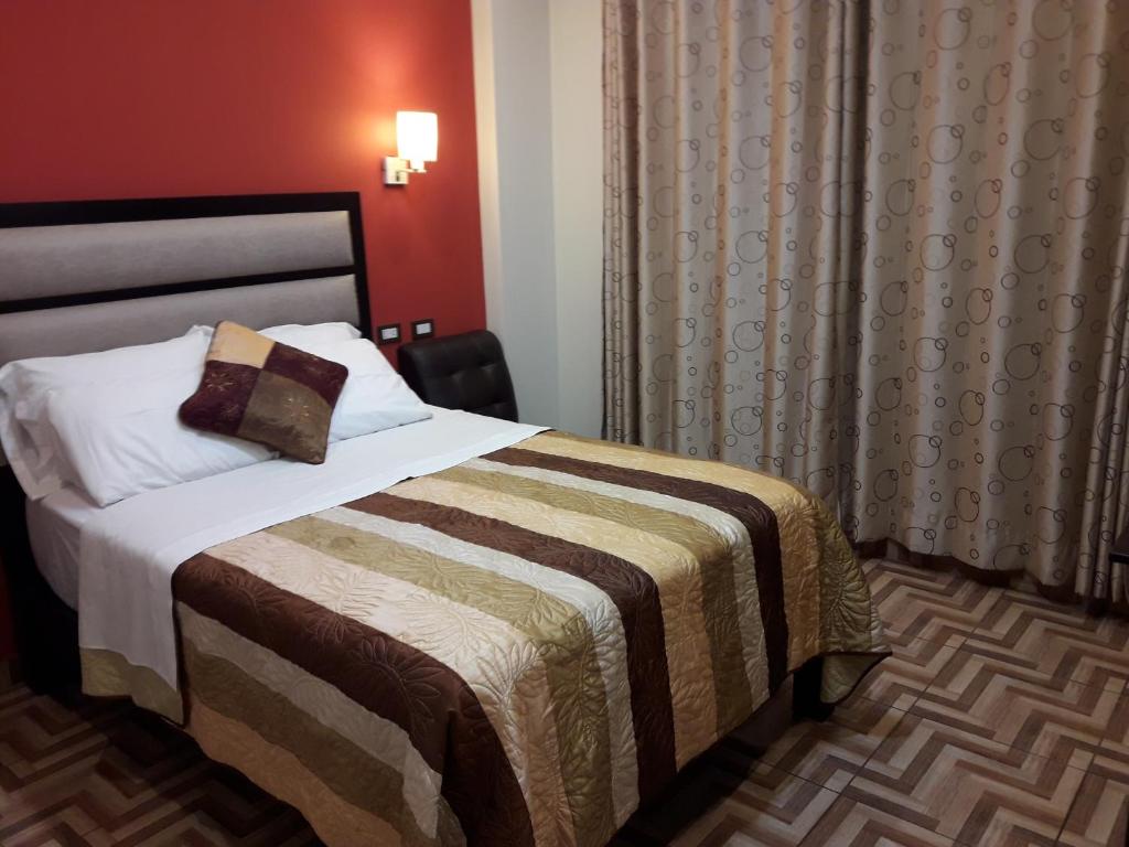 Postel nebo postele na pokoji v ubytování Gavina Inn Hotel