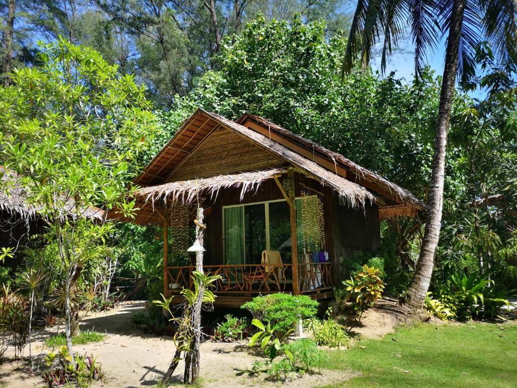 a small house in the middle of a forest at Hapla beach cottage in Ko Kho Khao