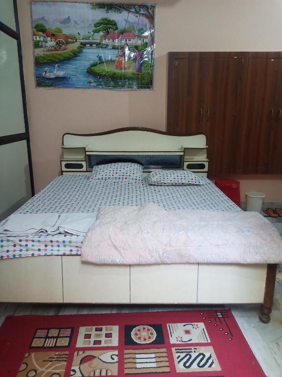 Postel nebo postele na pokoji v ubytování Sunita homestay