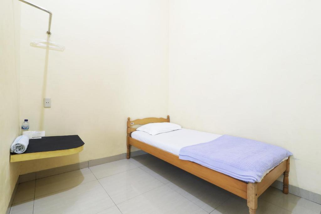 Postel nebo postele na pokoji v ubytování Krisna Hostel