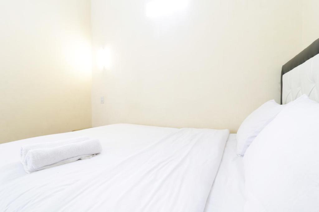 Postel nebo postele na pokoji v ubytování Krisna Hostel