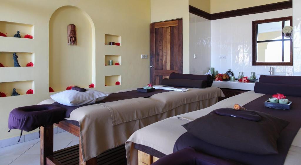 Postel nebo postele na pokoji v ubytování Neptune Pwani Beach Resort & Spa Zanzibar - All Inclusive