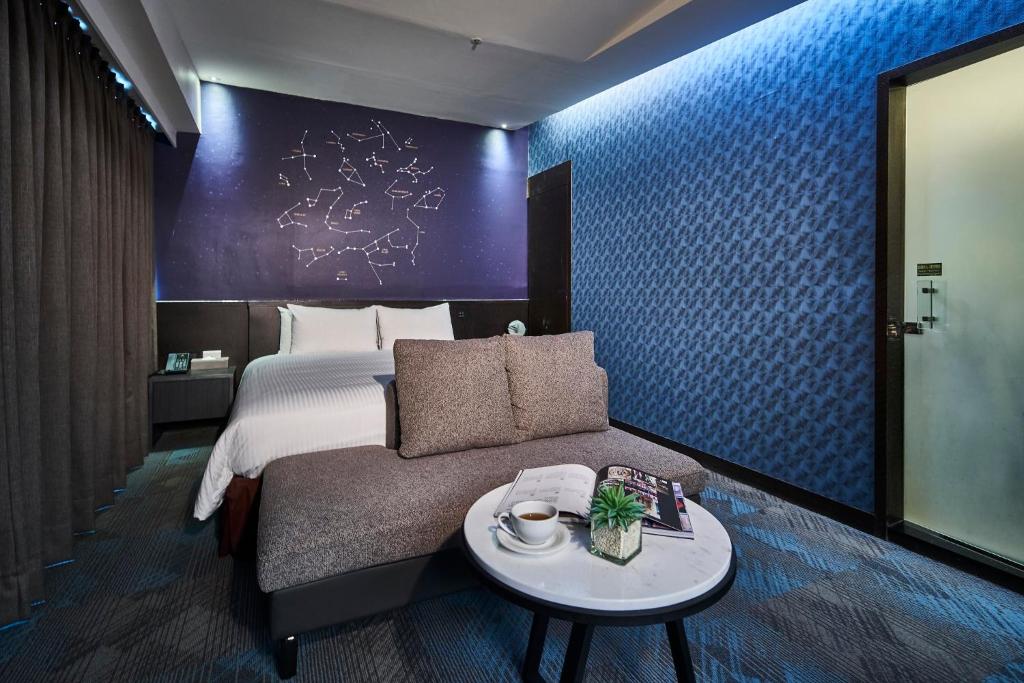 Postel nebo postele na pokoji v ubytování Kung Shang Design Hotel