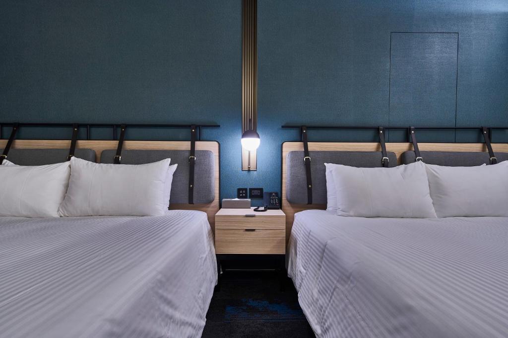 Postel nebo postele na pokoji v ubytování Kung Shang Design Hotel