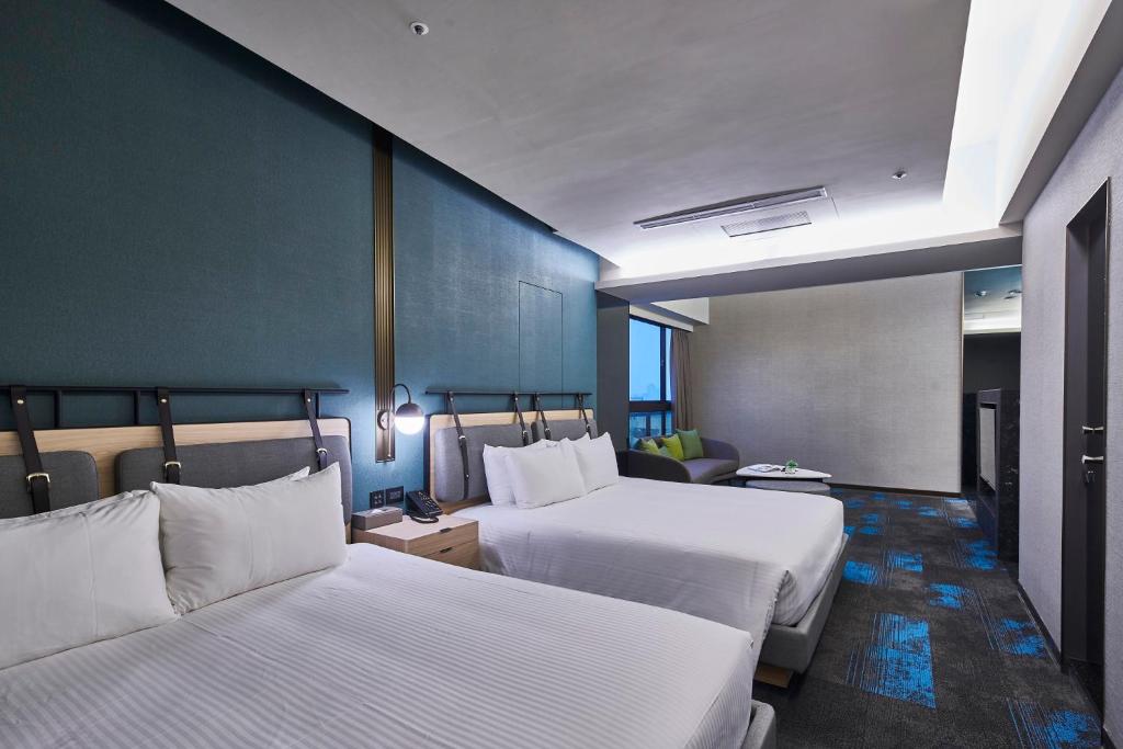 Postel nebo postele na pokoji v ubytování Kung Shang Design Hotel
