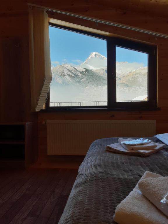 Postel nebo postele na pokoji v ubytování Four Season In Kazbegi