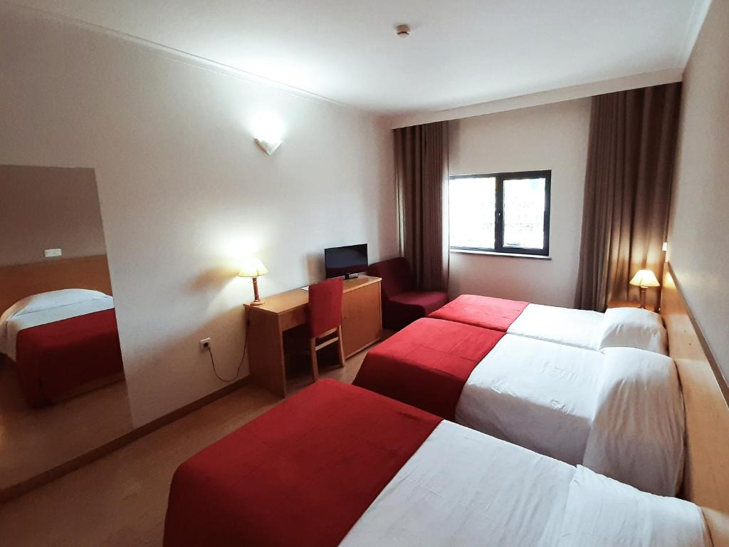 Postel nebo postele na pokoji v ubytování Hotel Durao