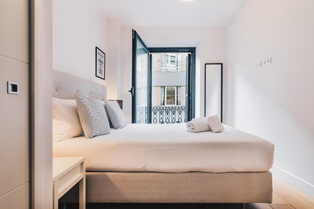Posteľ alebo postele v izbe v ubytovaní Domo by People Rentals