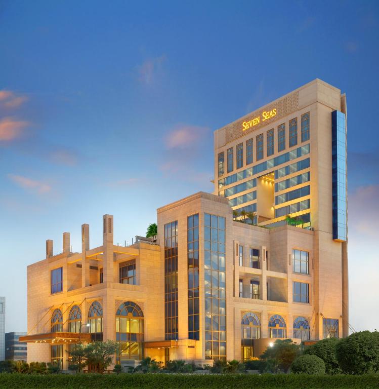 a building with a sanyo sign on the side of it at Seven Seas Hotel in New Delhi
