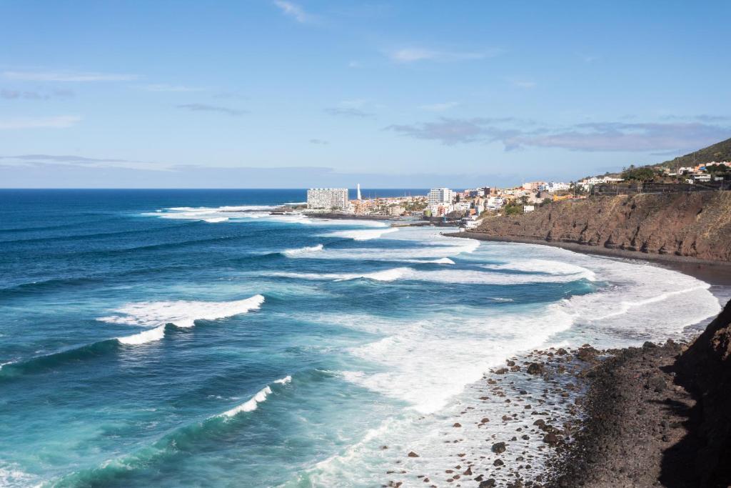 an aerial view of the ocean and a beach at In Tenerife, luxury apartment overlooking the Atlantic in Bajamar