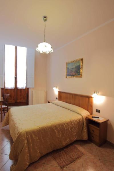 Posteľ alebo postele v izbe v ubytovaní Hotel Margaret