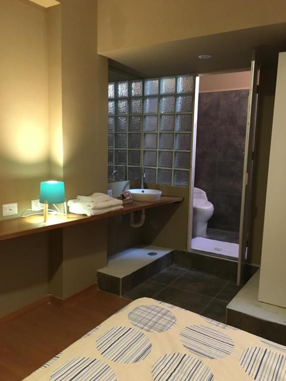 Postel nebo postele na pokoji v ubytování Terra Suites Ecogreen