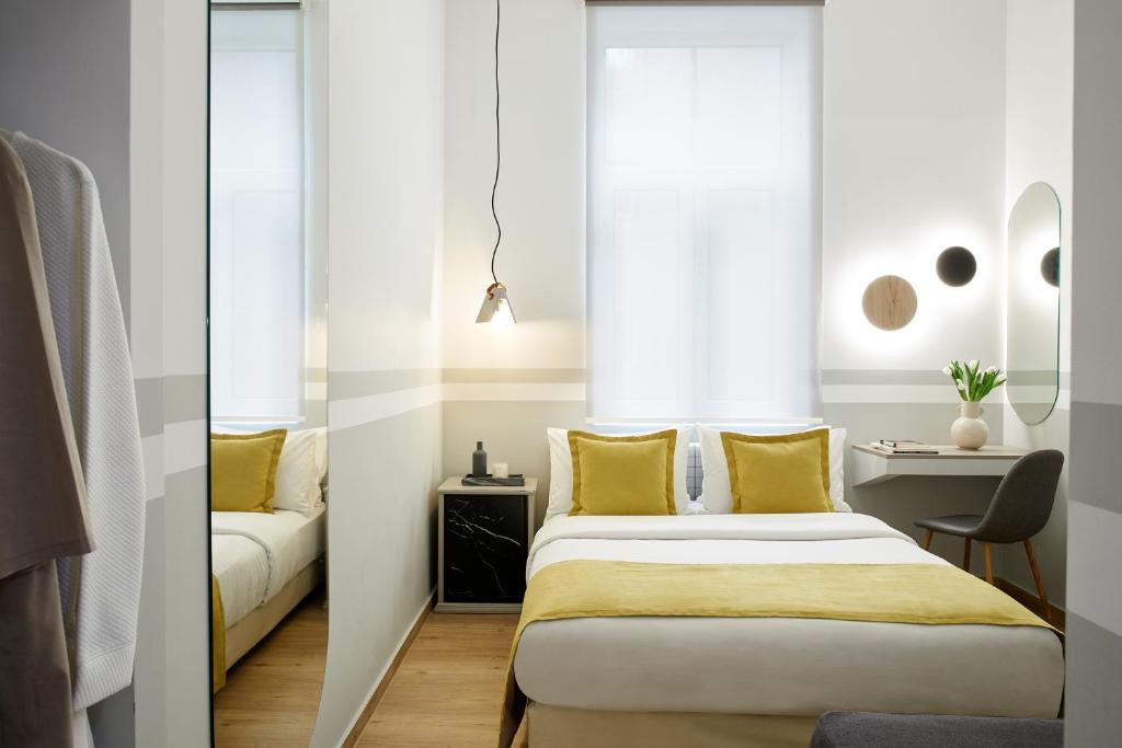 Posteľ alebo postele v izbe v ubytovaní Hotel Luxembourg