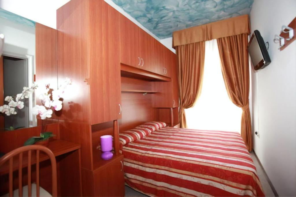Postel nebo postele na pokoji v ubytování Hotel Storione