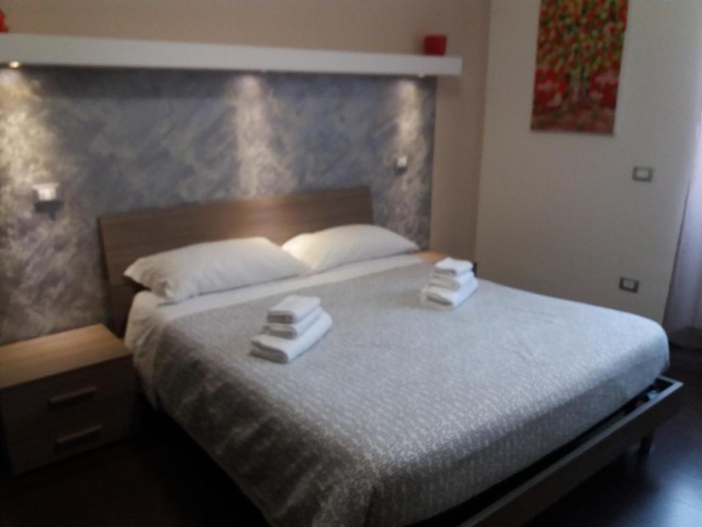 Posteľ alebo postele v izbe v ubytovaní Casa Vacanze Lory