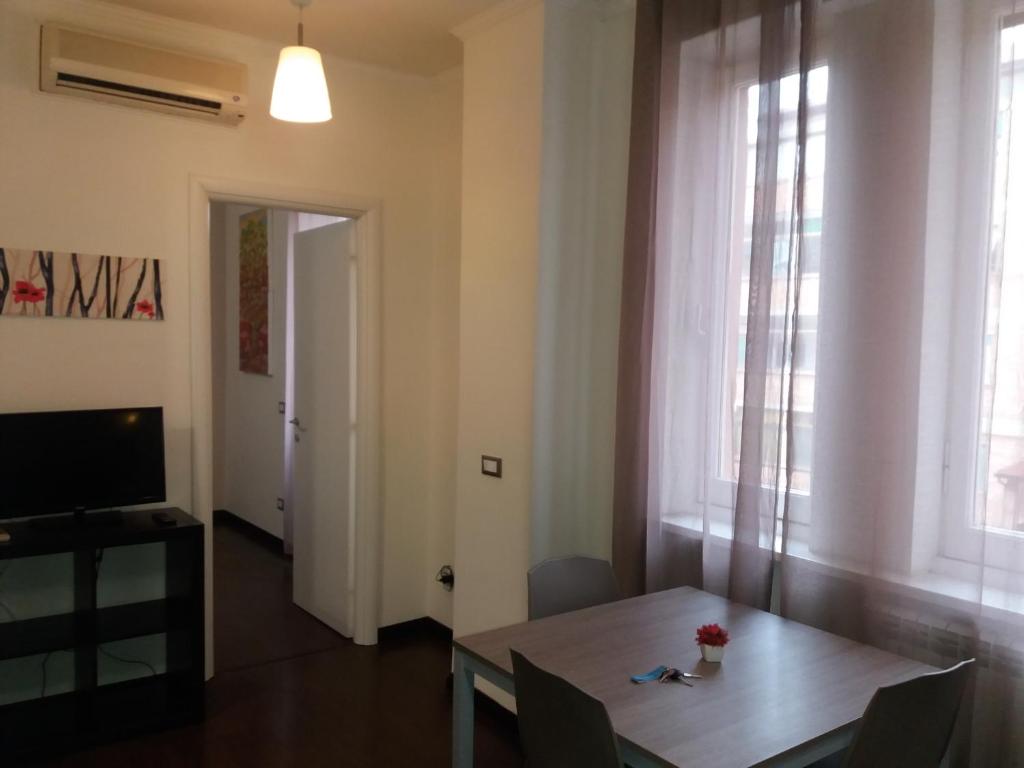 Televízia a/alebo spoločenská miestnosť v ubytovaní Casa Vacanze Lory