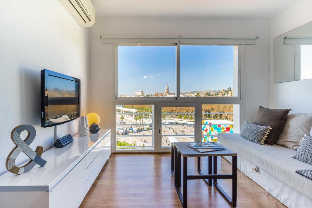 A television and/or entertainment centre at LU&CIA Málaga Skyline