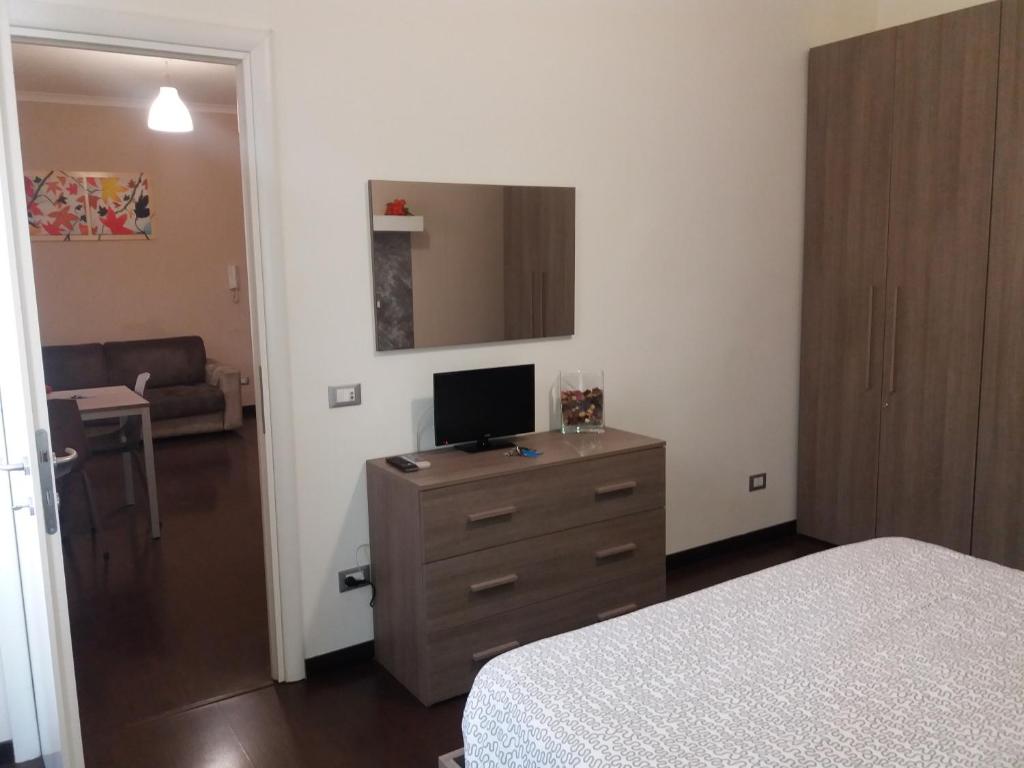 Televízia a/alebo spoločenská miestnosť v ubytovaní Casa Vacanze Lory